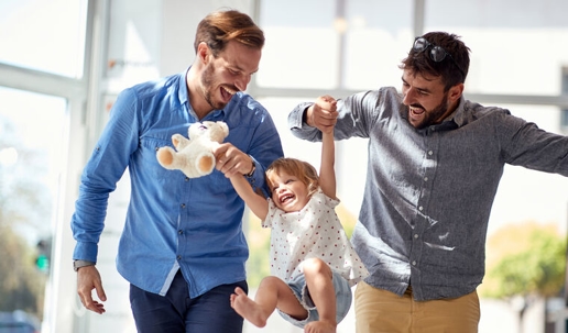 Same-sex co-parents with their son after divorce